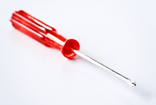 Miniature screwdriver with red handle