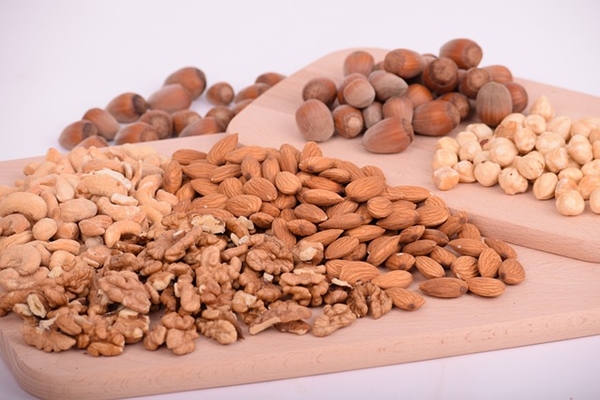 Assorted nuts on wooding cutting boards