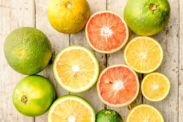 Lemons, limes and oranges sliced into halves
