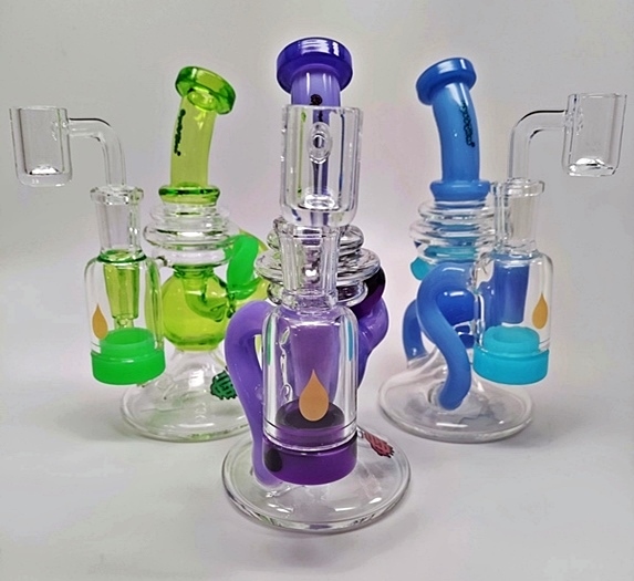 Three glass recycler dab rigs in assorted colors